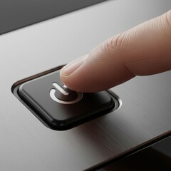 detail of a finger turning an electronic device on or off by pushing a button