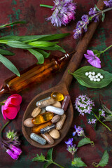 Aesthetically arranged herbal supplements on wooden background