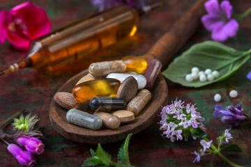 Herbal remedies on wooden spoon
