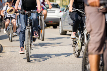 Group of cyclists on city road, street, asphalt