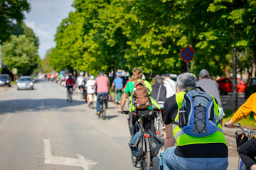 Group of cyclists on city road, street, asphalt