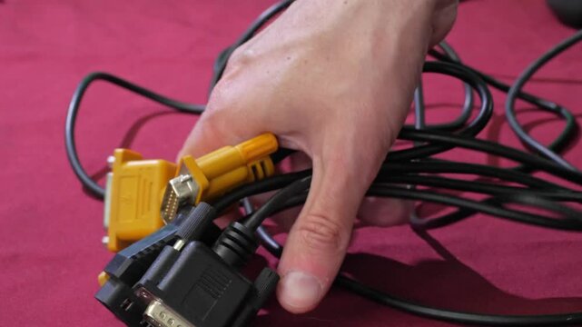 A close-up shot of multiple serial COM ports and their connected cables, likely from an older computer or industrial equipment. The connectors and wiring are clearly visible