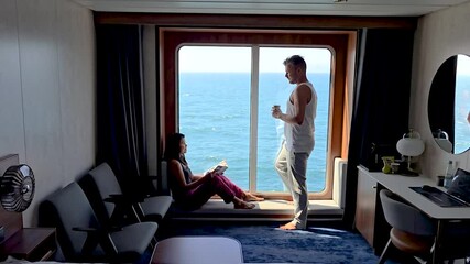 A couple enjoys a peaceful moment together in a cozy accommodation, surrounded by stunning ocean vistas in Torshavn. The warm atmosphere enhances their connection as they unwind.