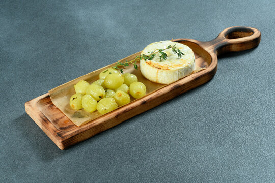 Fried cheese with grapes
