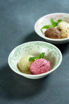 two scoops of ice cream in a bowl 