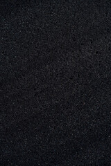 Background of porous foam rubber. Black foam rubber. Packaging material.