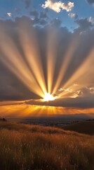 Time-lapse sun rays pierce through clouds with warm, golden brilliance. Vertical.