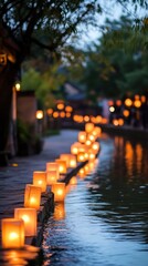 Lanterns with soft glows rest along a silent riverbank during the celebration. Vertical.