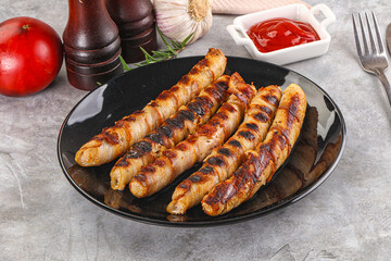 Grilled meat sausages wrapped bacon