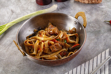 Asian cuisine udon with chicken and vegetables