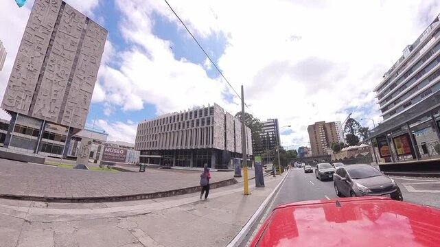 CHN Building in Guatemala City &mdash; filmed from moving car with dynamic truck-style movement and subtle motion blur for cinematic effect