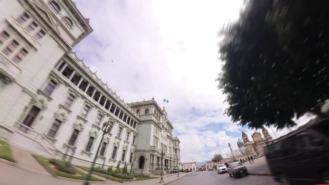Palacio Nacional de Guatemala in Parque Central &mdash; filmed from moving car with dynamic truck-style camera motion and light blur