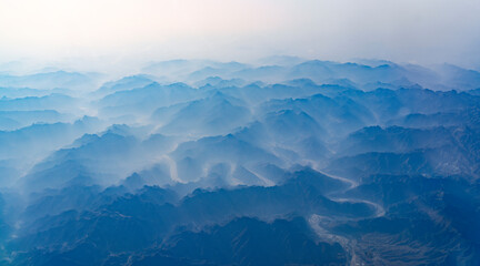 aerial view of mountain range in fog