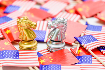 Golden and silver knight chess pieces represent the tactical competition between China and the US, surrounded by their respective flags, depicting the intricate trade negotiations, economic rivalries.