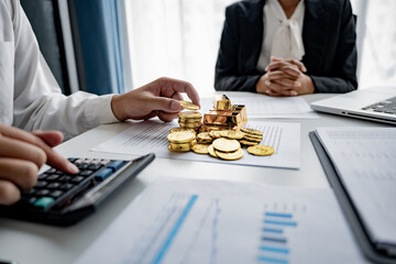 male investor examining gold ingots to diversify assets and reduce risk in economic downturn