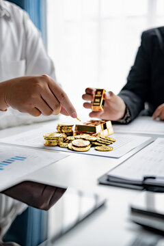 business partnership reviewing gold investment opportunities in financial market for mutual profit