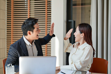 Excited Happy Business people looking on laptop successful agreement