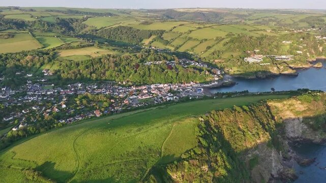 Drone footage of Combe Martin town with beautiful green hills on the north Devon coast