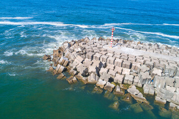 maritime engineering, durable breakwater against the waves. Aerial drone view