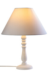 White table lamp with illuminated lampshade casting a soft glow