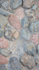 Full frame Nature background of old gray road stone pavement, close up organic stone texture for wall, abstract photo for interior or exterior design of large cobblestones, abstract vertical backdrop
