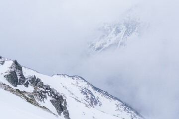 Winter Cliff with Rugged Rocks and Snow