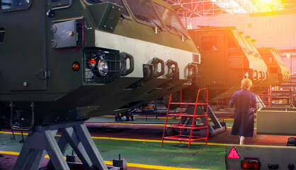 Manufacturing military vehicles at Wheel Tractor Plant facility in efficient production environment