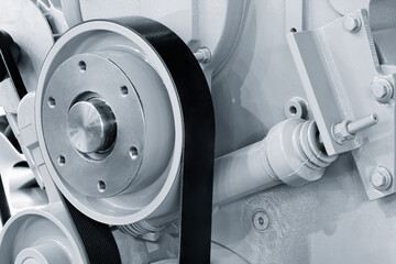 close up of car electric generator drive belt on engine, car service concept background