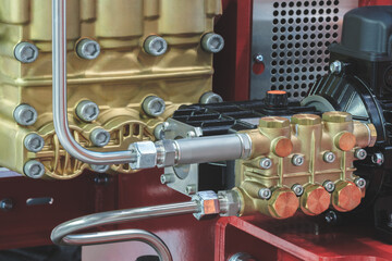 Copper block with valves on industrial air compressor, industrial concept background