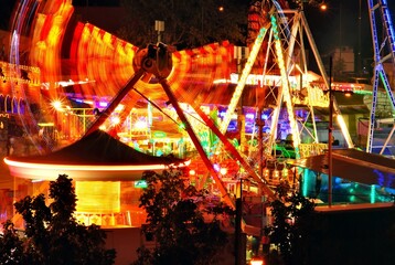 Night view of the carousels in movement during the spring festivities in Lleida, Catalonia