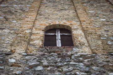 Stone Church Wall with Cross-Shaped Wooden Window