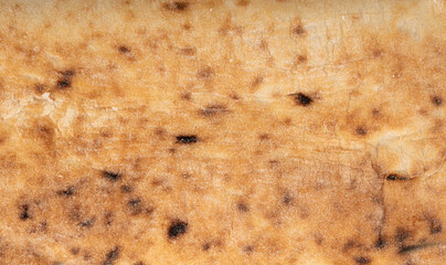 Focaccia flatbread slice macro texture, baked dough pattern. White bread loaf cut close up