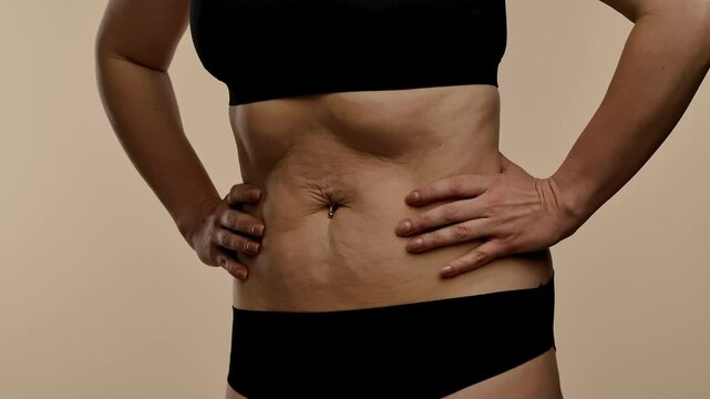 Woman in Black Lingerie Doing Stomach Vacuum Technique
