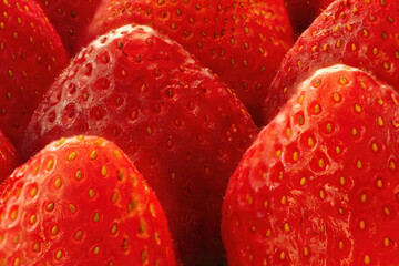 Close-up of strawberries arranged in diagonal rows.