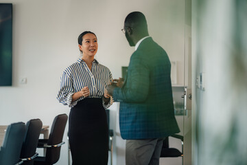 Businesspeople discussing strategy in modern office environment