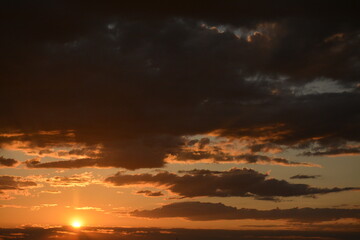 Evening sky with dark clouds. Sunset