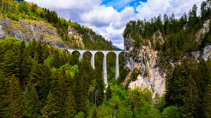 the famous swiss landwasser bridge of the rhaetische railway company
