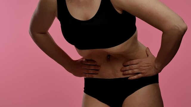 Woman in Black Lingerie Doing Stomach Vacuum Technique