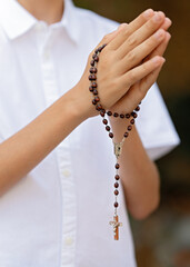 Child hands holding bible, serving God, praying hands, home church community