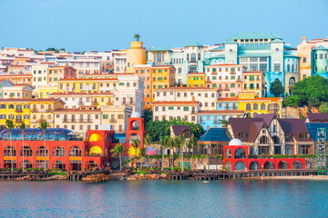 Colorful coastal cityscape with vibrant architecture, multicolored buildings, waterfront promenade, and tropical vibe in Sunset Town, Phu Quoc island, Vietnam. Italian architecture in Asia