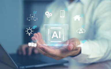 A person holding a glowing AI icon with digital interface graphics, representing artificial intelligence technology, automation, and innovation.