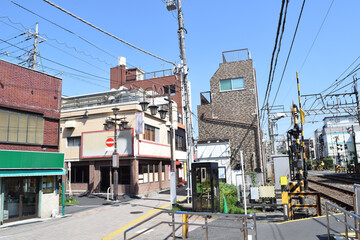 Cityscape with power lines and railway crossing in Tokyo, Japan