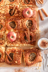 Sweet apple yeast cake made of cinnamon and fruits.