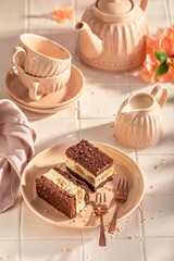 Sweet sponge cake with fluffy cream layer and glaze.