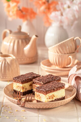 Homemade sponge cake with glaze and cream layer.