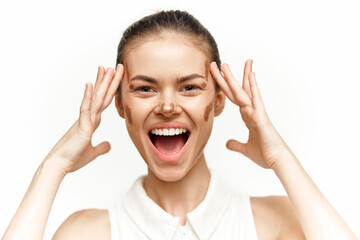 Joyful young woman expressing happiness with hands on her head, showcasing excitement and...
