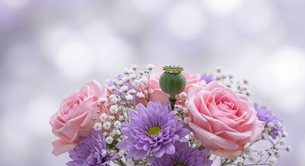Delicate floral arrangement with soft pink roses and lavender chrysanthemums beauty