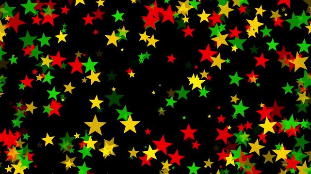Stars floating in bold red, yellow, and green colors on black background for Juneteenth, or Freedom Day, to commemorate the ending of slavery on June 19th 1865 in the United States of America.
