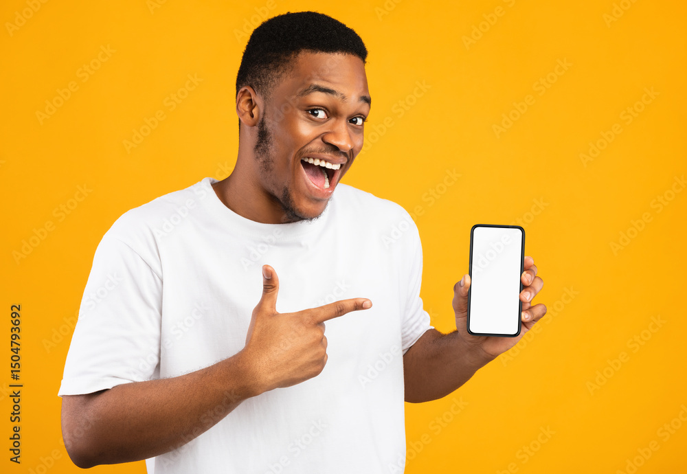 Leinwandbilder african american guy showing smartphone empty screen recommending mobile application smiling to came