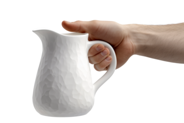 Hand Holding White Ceramic Jug Against Transparent Background in Close-Up View